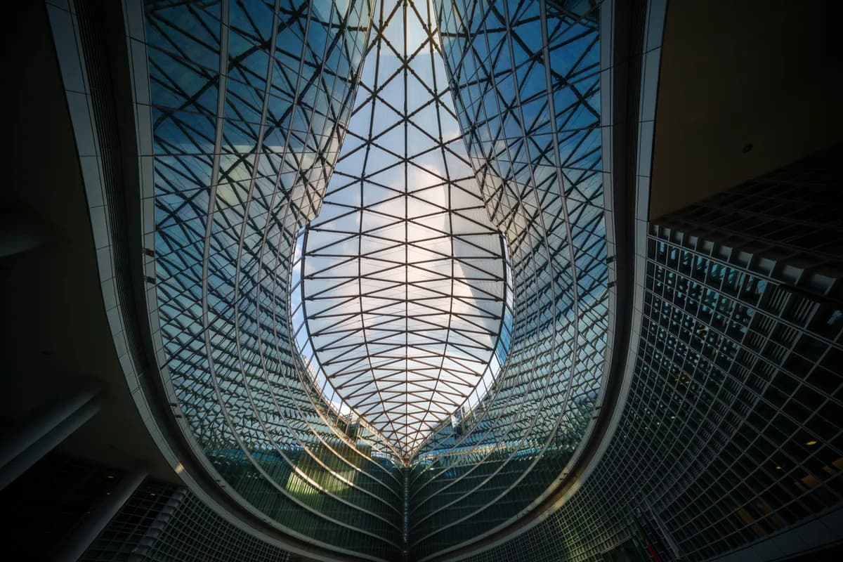 Curved glass atrium ceiling with a steel lattice framework